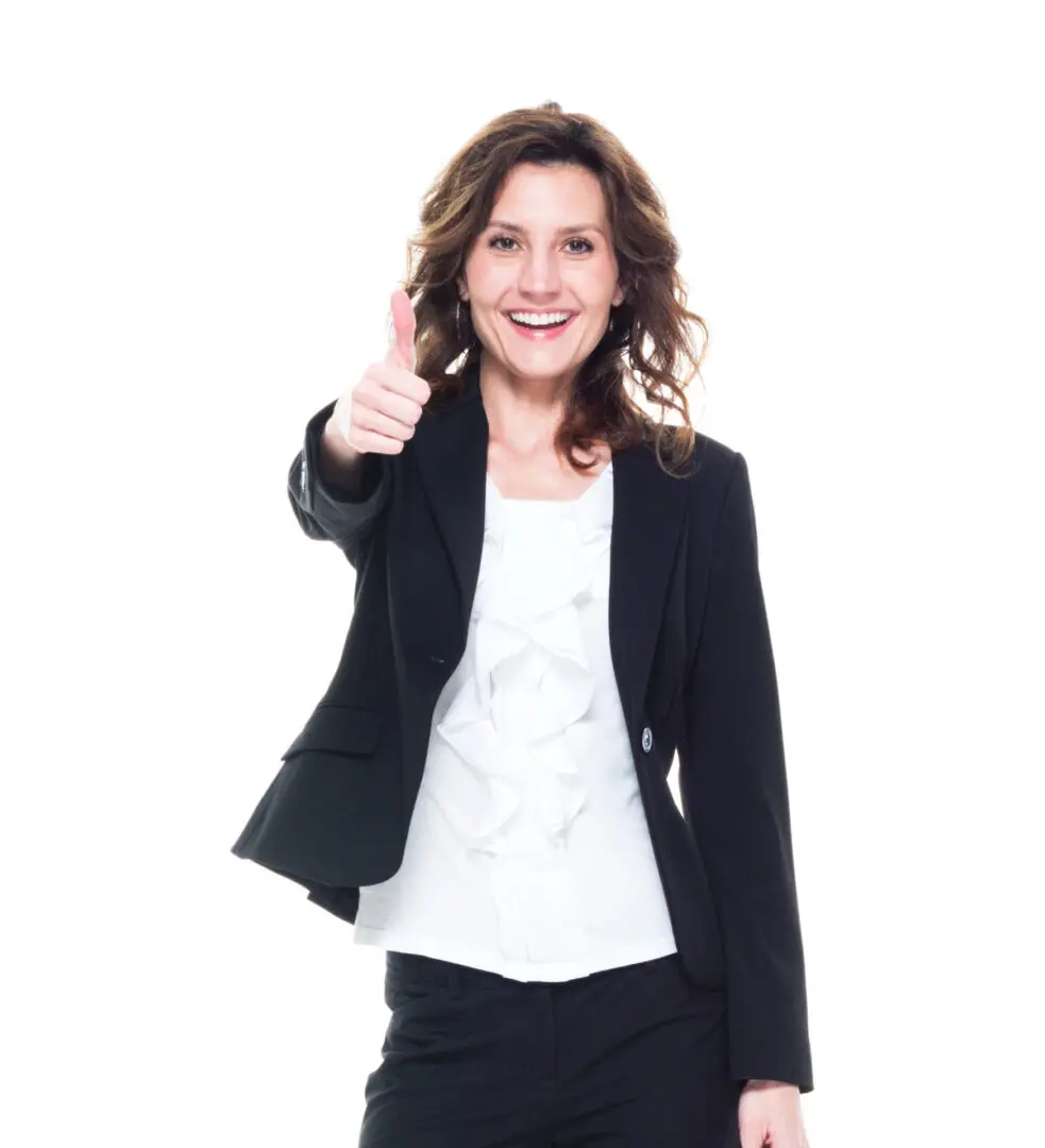 A woman giving the thumbs up sign in front of a white background.